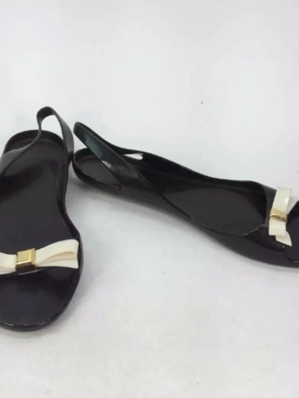kate spade Black Jelly Flats with Cream Bow and Gold Accent